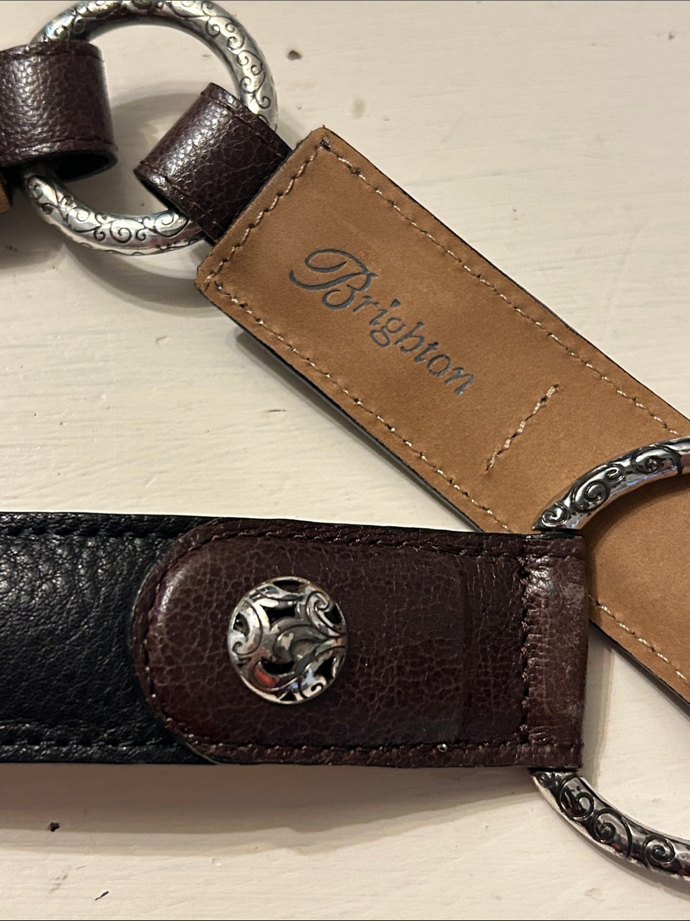 Brighton black and brown leather belt featuring silver-plated, etched rings S/32